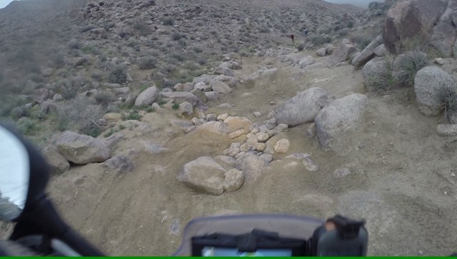 Real rock gardens on the other side of the pass. Notice the projected light of the bike - it is getting dark